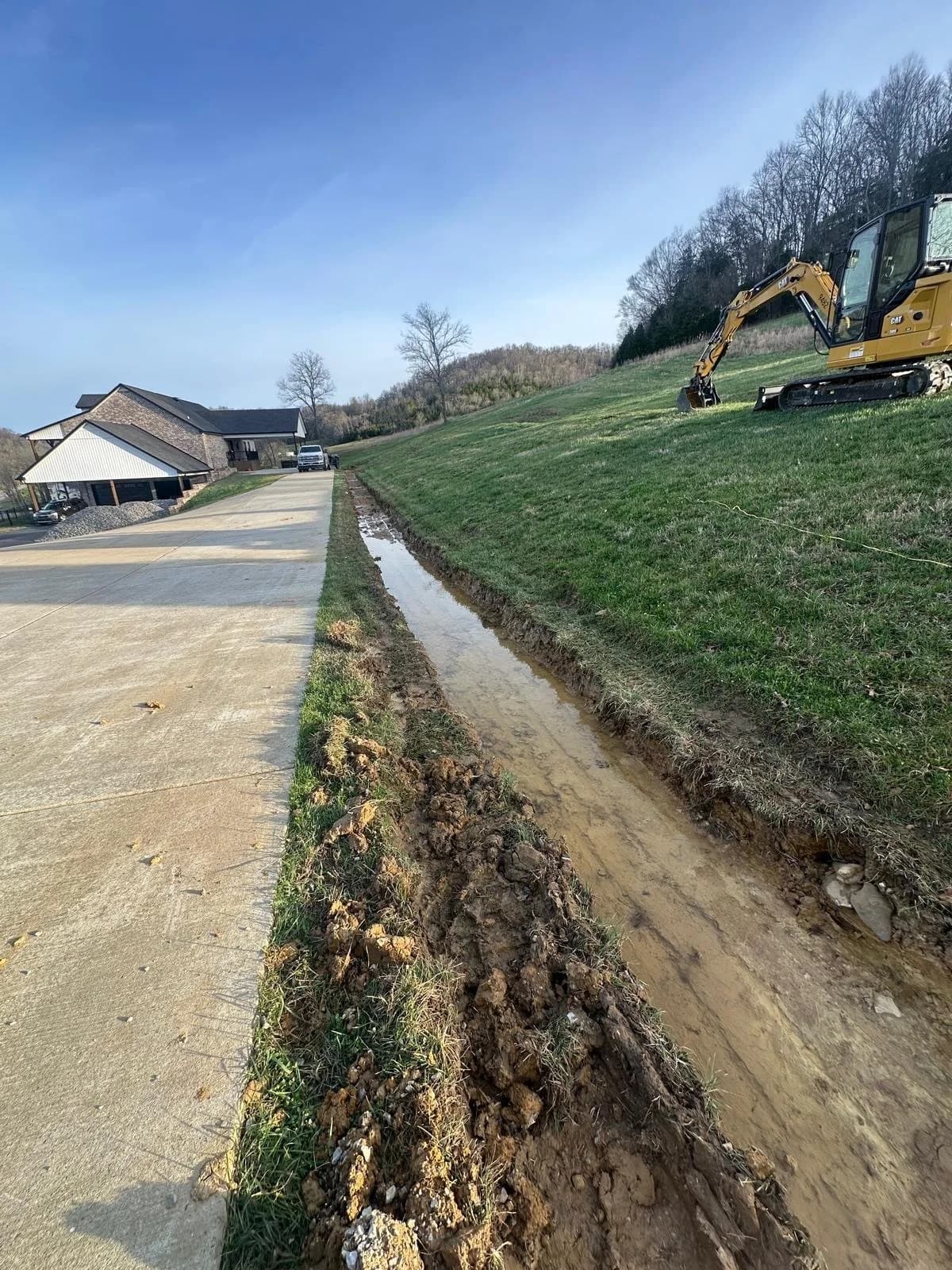 A VolLand crew trenching and preparing a site during project execution near Murfreesboro.
